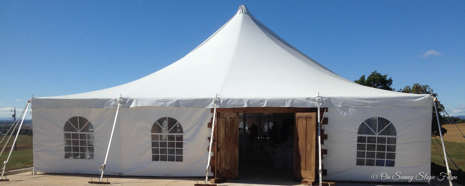 New barn doors on tent allow for heating and cooling On Sunny Slope Farm